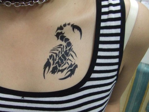 scorpion_tattoo_design_on_chest_for_women_2011.jpg